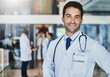 © ClearConcept/peopleimages.com - Doctor, face and pride in hospital for healthcare, wellness or medical experience with stethoscope. Man, portrait and smile as surgeon in health facility with confidence for cardiology or medicine