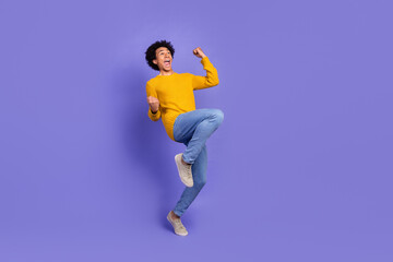 Canvas Print - Photo of cheerful glad funky man wear stylish yellow clothes scream hooray empty space isolated on purple color background