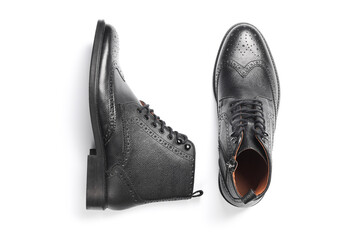 Sticker - Stylish black leather men's brogue boots isolated on white background. Top view. Flat lay