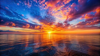 Wall Mural - Vibrant sunset over the calm sea , twilight, orange sky, ocean waves, horizon, scenery, tranquil, sun reflection, peaceful