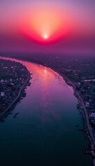 Wall Mural - Aerial view of the beautiful sunset over the Ganges river passing through populated areas