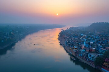 Wall Mural - Aerial view of the beautiful sunset over the Ganges river passing through populated areas