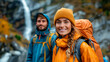 © Favio - Happy hikers enjoying nature on a mountain trail with backpacks.