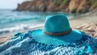© masanyanka - Coastal Retreat: Summer Relaxation with Straw Hat and Beach Blanket