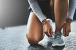 © ClearConcept/peopleimages.com - Fitness, hands and person tie shoes to start exercise, training or workout at health club on floor. Legs, athlete and tying lace on sneakers to prepare or getting ready for sport or wellness in gym