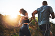 © peopleimages.com - Back view, woman and man running on mountain for fitness, exercise and together for wellness. Sunshine, couple and happy in nature for health, support and performance for marathon training in morning