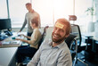 © peopleimages.com - Man, portrait and paper on forehead in office with happy reminder, work break and comedy prank by desk. Business worker, guy laughing and sticky note on face with smile, funny and workplace humor
