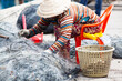 © robertharding - Mending fishing net, Nam Du Islands, Kien Giang, Vietnam, Indochina, Southeast Asia, Asia
