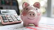 © Valentin - Piggy Bank and Calculator on Financial Documents