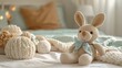© TOTO - Cozy knitted stuffed toys on a bed in a softly lit room