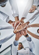 © ClearConcept/peopleimages.com - Hands stack, low and medical people in hospital for healthcare support, solidarity and teamwork of workforce motivation. Staff, diversity and collaboration, trust and synergy together of clinic