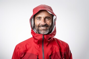 Wall Mural - Portrait of a content man in his 40s wearing a windproof softshell on white background