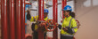 © kanpisut - Engineer or technician work checking Fire suppression system and fire equipment. Engineer check red generator pump for water sprinkler piping and fire alarm control system