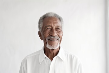 Wall Mural - Portrait of a blissful afro-american elderly 100 years old man wearing a classic white shirt in front of modern minimalist interior