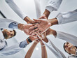 © peopleimages.com - Low angle, hands stack and medical people in hospital for healthcare support, solidarity and teamwork of workforce. Staff, diversity and collaboration, trust and synergy together for partnership