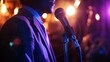 © Varunee - Male jazz singer sings jazz songs on stage at night in jazz club. that makes a difference.