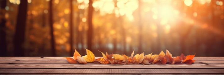 Wall Mural - Autumn Leaves on Wooden Table with Blurred Forest Background