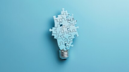 Wall Mural - Puzzle pieces forming the shape of a light bulb on a blue background, representing creative business ideas