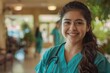 © Vorda Berge - Young Hispanic nurse wearing scrubs in a nursing home