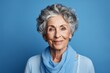 © Vorda Berge - Beauty studio portrait of a elegant senior woman on blue background