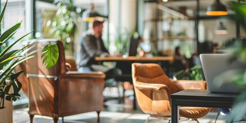 Wall Mural - A man is sitting in a leather chair in front of a laptop