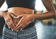 © peopleimages.com - Health, digestion and hands on stomach for woman in gym, nutrition and gut support detox. Wellness, fibre and female person, diet and balance fitness lifestyle for belly weight loss with ozempic