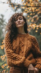 Canvas Print - A woman with curly hair wearing a brown sweater