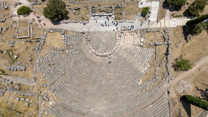 Wall Mural - Aerial bird's eye view photo taken by drone of archaeological site of ancient Delphi, site of temple of Apollo and the Oracle, Voiotia, Greece