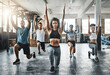 © peopleimages.com - Class, exercise and lunge in group at gym for workout, core fitness or training together indoors. Diverse people, friends or warm up for ab muscle, session and sport for health challenge in gymnasium