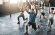 © ClearConcept/peopleimages.com - Friends, fitness and lunge in group at gym for workout, core exercise or training together indoors. Diverse class, people or warm up for ab muscle, session and sport for health challenge in gymnasium