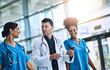 © peopleimages.com - Healthcare, teamwork and doctor with nurses, medicine and talking together at hospital with trust. Medical, collaboration and smartphone with clinic, result and specialist for diagnosis and insurance