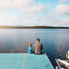 Wall Mural - Relax, back and child fishing with father at lake for vacation, together and dock in morning. Family, man and kid in nature by water for holiday, learning or gear for outdoor adventure with dad