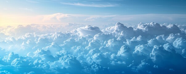 Vast and serene sky filled with fluffy white and blue clouds at sunrise