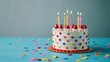 © Irina Ukrainets - Colorful birthday cake with candles and polka dots on blue background. Vibrant and joyful celebration. A fun dessert for birthday parties or celebrations. Perfect for festive occasions. AI