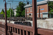 © Anze - A bunch of concrete rail sleepers with screws and plates attached are resting on a flad bed wagon on a railway station