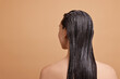 © New Africa - Woman with applied hair mask on beige background, back view. Space for text