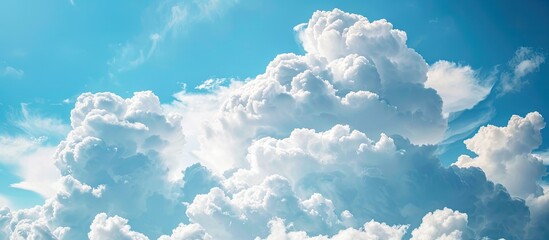 Wall Mural - Cloud-filled sky with beautiful white fluffy clouds providing a serene backdrop, perfect for a copy space image.