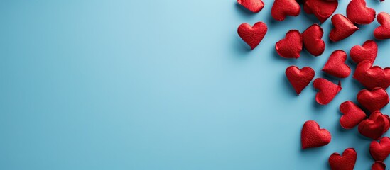 Sticker - Minimalistic Valentine's Day concept with red hearts against a film-blue backdrop gives your text a place to land in this flat lay style image, ideal for conveying affection. Copy space image
