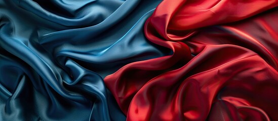 Top view of luxurious red and blue silk fabric creating an elegant background with a copy space image.
