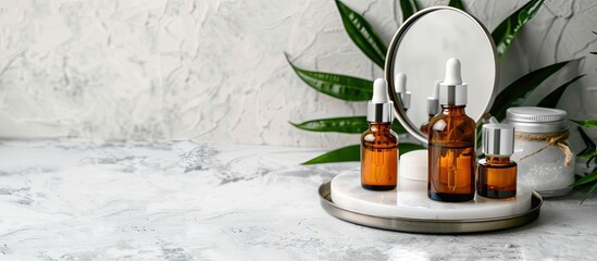 Sticker - Light grey table with bottles of essential oil, mirror, and copy space image.