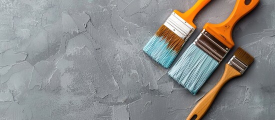Poster - home improvement concept with paintbrush and tools. flat lay view with empty space for text or image