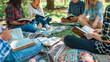 © Катерина Євтехова - a detailed image of a Bible study group meeting outdoors, sitting on blankets with Bibles in hand, church, Studying, Group Of People, Community, Meeting, Bible, with copy space