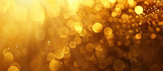 Wall Mural - Golden abstract background with bokeh effects ideal for copy space image.