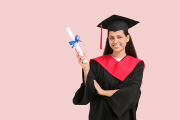 Wall Mural - Happy female graduate with diploma on pink background