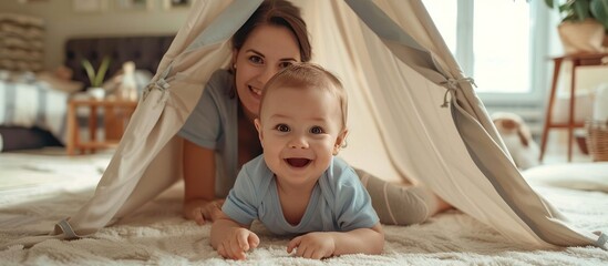 Mother and Baby Playing in a Tent