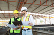© DG PhotoStock - Construction engineers team working - discussing together.