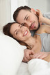 © New Africa - Family portrait of lovely couple on bed at home