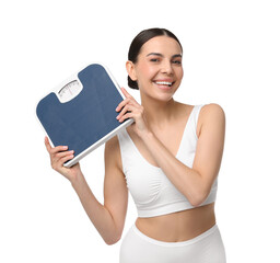 Wall Mural - Diet and weight loss concept. Happy young woman with floor scale on white background