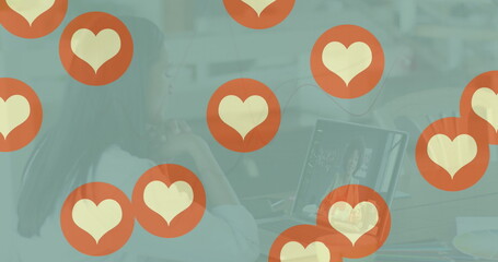 Poster - Image of heart icons over caucasian woman using laptop