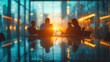 © hisilly - Silhouettes of Business Professionals Discussing Ideas in Meeting Room with Blurred Glass Wall Background